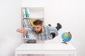 Man in plaid shirt flying above office desk like superman