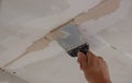 man plastering ceiling, repair. Selective focus Royalty Free Stock Photo