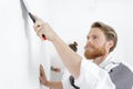 man plastering wall with putty-knife Royalty Free Stock Photo