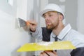 man plastering wall with trowel Royalty Free Stock Photo