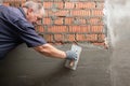 Man plastering wall. Worker makes renovation. Construction work Royalty Free Stock Photo