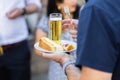 Man with a plate of cake and a glass of beer