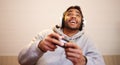 Man play video games, headphones and controller for esports, online streaming and happy at home. Male gamer, smile with Royalty Free Stock Photo