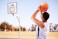 Man, player and shot on basketball outdoor court for point jump athlete, game challenge in summer. Male person, arm and Royalty Free Stock Photo