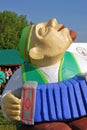 A man playing accordeon. Sculpture.