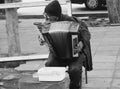 man playing accordeon in the street