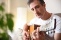 Man playing acoustic guitar close up Royalty Free Stock Photo