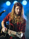 Man playing acoustic guitar in concert Royalty Free Stock Photo