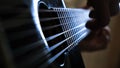 Man playing acoustic guitar at home, hand close-up. Concept. Close-up of a man playing a guitar Royalty Free Stock Photo