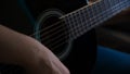 Man playing acoustic guitar at home, hand close-up. Concept. Close-up of a man playing a guitar Royalty Free Stock Photo