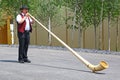 Man playing alphorn in Expo 2015, Milan