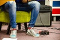 Man Playing Amplified Acoustic Guitar