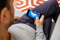 Man playing arcade game on the new iPhone x by Apple Computers