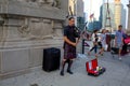 A man is playing bagpipes on street Royalty Free Stock Photo
