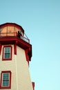 Twilight Bagpiper on Illuminated Lighthouse Royalty Free Stock Photo