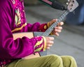 Man playing balalaika. Royalty Free Stock Photo