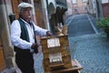 A man is playing on barrel organ