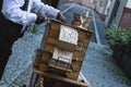 A man is playing on barrel organ