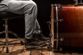 Man playing the bass drum, wood Board with a black background Royalty Free Stock Photo