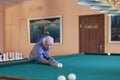 Russia, Moscow, April 7, 2018, a man playing Billiards in a nursing home, editorial