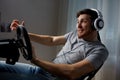 Man playing car racing video game at home Royalty Free Stock Photo