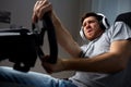 Man playing car racing video game at home Royalty Free Stock Photo