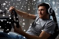 Man playing car racing video game at home Royalty Free Stock Photo