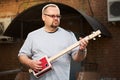 Man playing cigar box guitar Royalty Free Stock Photo