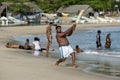 A man playing cricket on Arugam Bay beach in Sri Lanka. Royalty Free Stock Photo