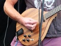 Man playing a custom electric guitar in close up