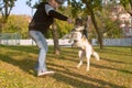 Man playing with the dog in the park Royalty Free Stock Photo