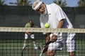 Man Playing Doubles On Tennis Court