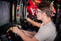 Man playing driving wheel video game Royalty Free Stock Photo