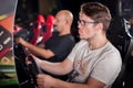 Man playing driving wheel video game Royalty Free Stock Photo