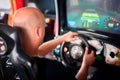 Man playing driving wheel video game Royalty Free Stock Photo