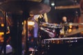 The man is playing drum set in low light background. Royalty Free Stock Photo