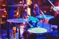 The man is playing drum set in low light background. Royalty Free Stock Photo