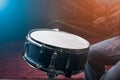 The man is playing drum set in low light background. Royalty Free Stock Photo