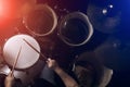 The man is playing drum set in low light background. Royalty Free Stock Photo