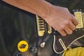 Man playing electric guitar detail. Musician. Musical instrument