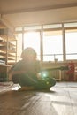 Man playing electric guitar on floor at sunny home Royalty Free Stock Photo