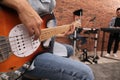 Man playing electric guitar during rehearsal in studio, closeup. Music band practice Royalty Free Stock Photo