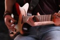 Man playing electric guitar on stage, closeup. Rock concert Royalty Free Stock Photo