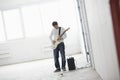 Man Playing Electric Guitar In Warehouse Royalty Free Stock Photo