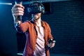 Man playing game with virtual reality headset in the club Royalty Free Stock Photo