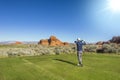 Man playing golf on a beautiful scenic desert golf course Royalty Free Stock Photo