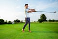 Man playing golf on a golf course in the sun Royalty Free Stock Photo