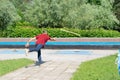 Man playing gorodki in the park Royalty Free Stock Photo