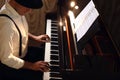 Man playing grand piano. Talented musician Royalty Free Stock Photo