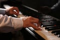 Man playing grand piano, closeup. Talented musician Royalty Free Stock Photo